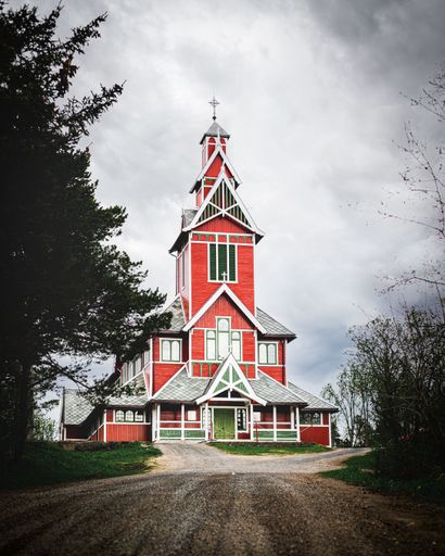 A vertical shot of a beautiful Buksnes Church in Norway