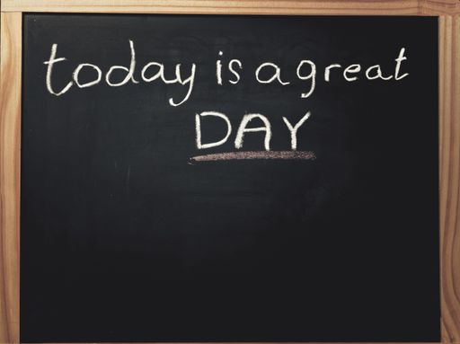 word today is a great day written on a black chalk board with chalk