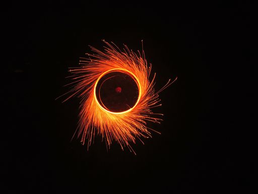A spinning round fire circle in long exposure