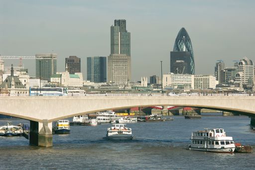 A beautiful shot of the Waterloo Bridge over the river Thames with skyscrapers in the background
