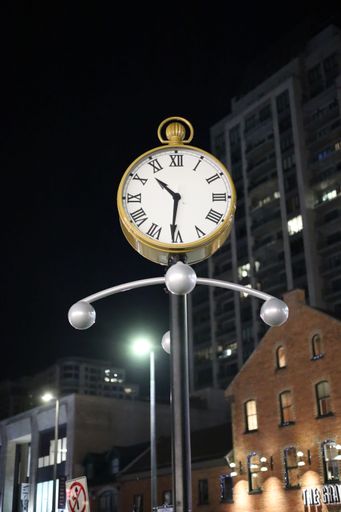 A street clock in background of buildings