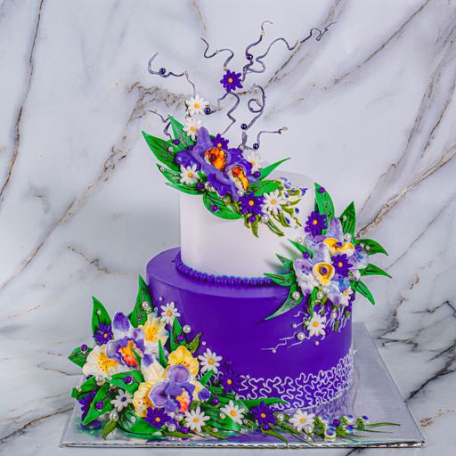 A vertical shot of a fancy cake with decorative flowers