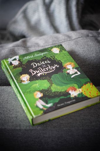 The Polish version of Astrid Lindgren "The Six Bullerby Children" book on a bed