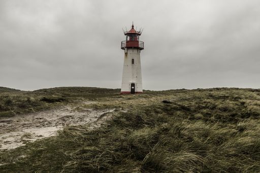 A low angle shot of the Lighthouse List East at Sylt, Germany under the storm clouds