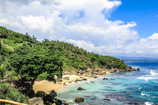 A breathtaking shot of mountains at the shore of the ocean in Sumba, Indonesia