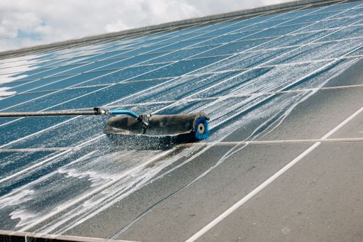 A close-up shot of solar system panel cleaning process