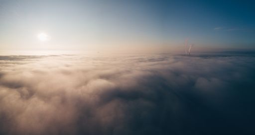 A beautiful aerial shot of clouds and the sun in the sky