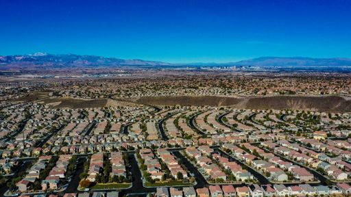 A high desert neighborhood with many houses against the blue sky in the South of Las Vegas
