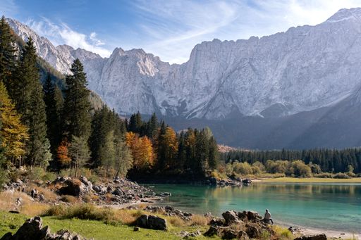 A beautiful landscape of a dense forest by Fusine lakes