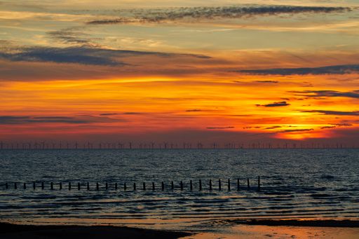 A bright orange sunset sky over Walney Island, Barrow-in-Furness, England