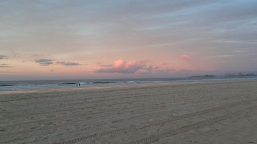 The empty beach against the background of beautiful sky at sunset.