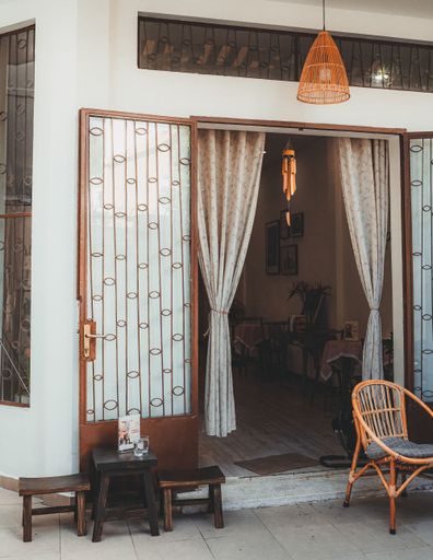 A vertical shot of the balcony area of a beautiful cafe in Ho Chi Minh City, Vietnam