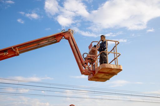 A low angle shot of a man working at a construction site - concept of construction