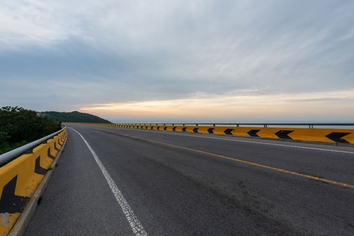 A close-up shot of a seaside road with sunset view in Dalian, China