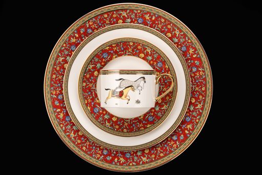 A top view closeup shot of luxury ceramic tableware isolated on the black background