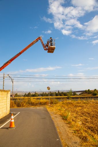 A vertical low angle shot of a man working at a construction site - concept of construction
