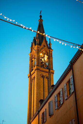 A low-angle shot of a building under the clear sky in Italy