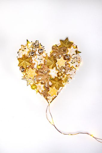 Heart shape made with festive Christmas decorations and cookies