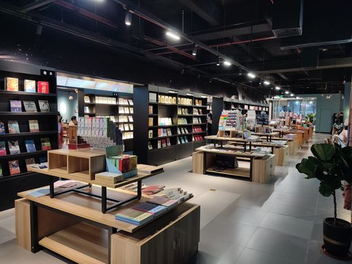 A bookstore with wooden shelves in Haikou shopping mall, China
