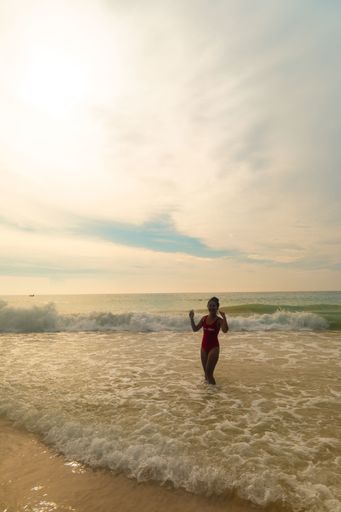Girl on the beach in Thailand. Enjoying her holiday.