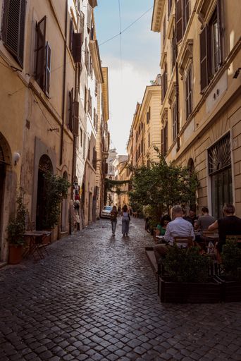 A vertical shot of the narrow busy streets of Rome Italy
