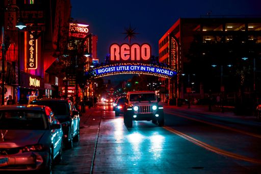 A beautiful view of cars in the street with neon lights in Downtown Reno, Nevada
