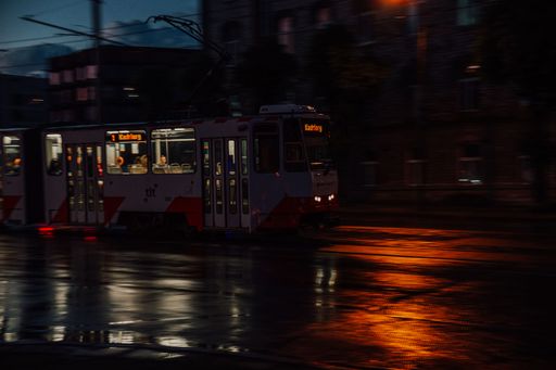 A vintage tram route in Tallinn to the station Kadriorg at night with street lights