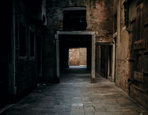 The inside of an old, abandoned building with multiple halls