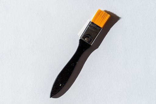 A top view shot of a paintbrush isolated on white background