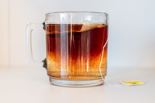 A closeup shot of a cup of tea isolated on white background