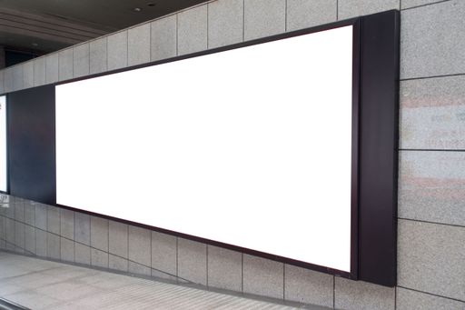 An empty hallway with white screens on the wall