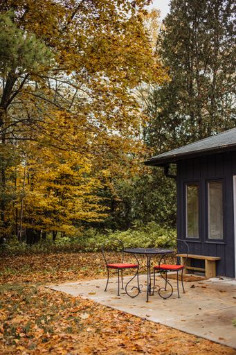 The house surrounded by colorful trees in autumn - great for wallpapers