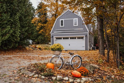 The house surrounded by colorful trees in autumn - great for wallpapers