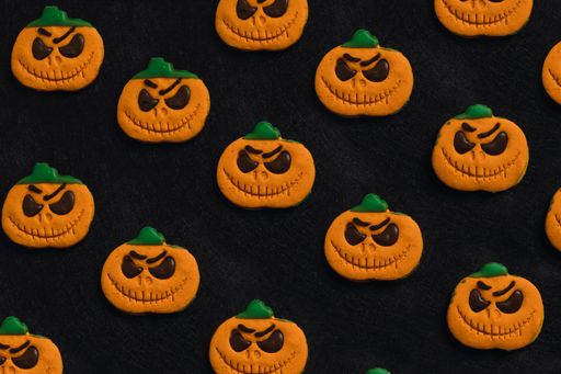 A closeup of Halloween cookies in black background