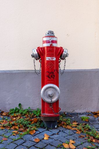 Fire hydrant in front of a wall. Minimalistic shot