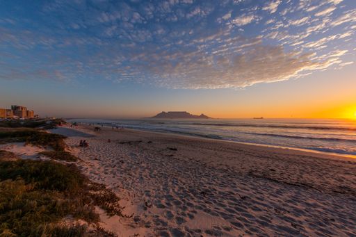 A beautiful shot of the sunset over the shore of the famous Table mountain in Cape Town, South Africa