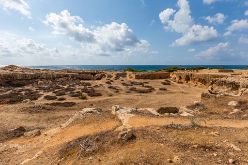A high angle shot of a beach under the cloudy sky in Cyprus