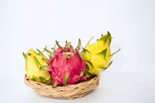 A few Pitaya or Dragon Fruits in the basket isolated with white background