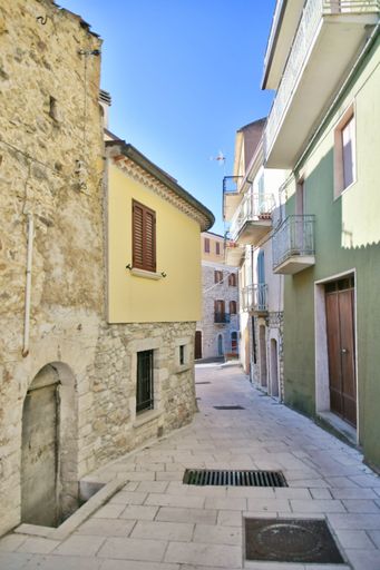 A narrow street between the old stone houses of Bagnoli del Trigno, a medieval village in the Molise region of Italy.