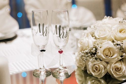 A closeup shot of Mr and Mrs champagne sparkling wine glasses