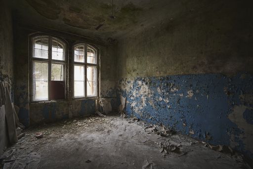 An old abandoned building with windows