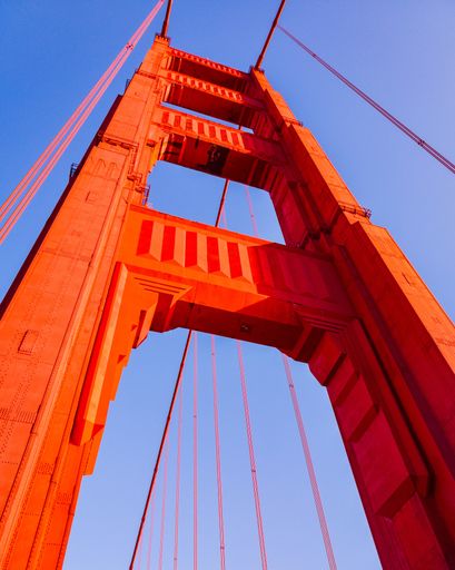 A vertical low angle shot of Golden Gate Bridge located in San Franciso, CA
