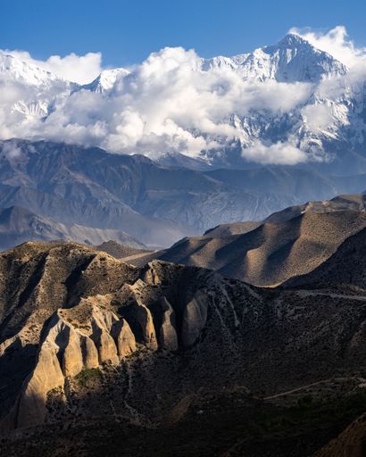 A vertical shot of the beautiful Nilgiri and Annapurna mountain ranges in the Himalayas, Nepal