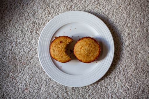 A top view of bitten and full pieces of cake on a plate