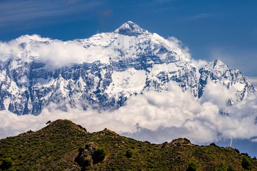 A stunning view of rocky and snowy Annapurna and Nilgiri mountains in the  Kingdom of Mustang depicting the blue view