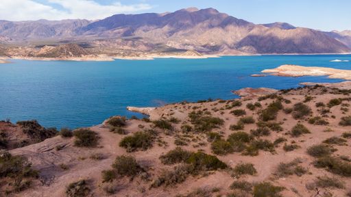 An aerial view of the Lake Potrerillos on a sunny day in Mendoza, Argentina