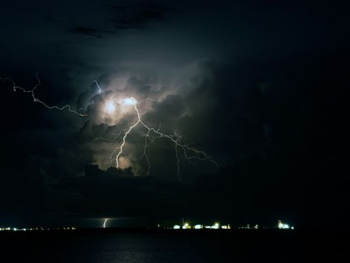 A scenic shot of a lighning strike at night