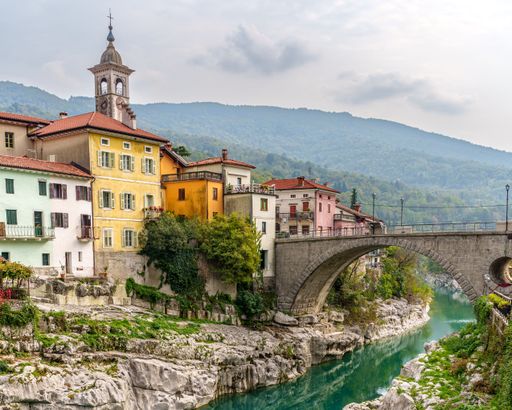 The beautiful colorful historic buildings near a bridge in Kanal ob Soci, Slovenia