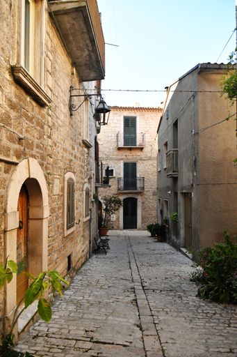 A narrow street between the old stone houses of Oratino, a medieval village in the Molise region of Italy.